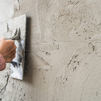 hand-worker-plastering-cement-wall-background-gre-2025-01-08-00-43-30-utc